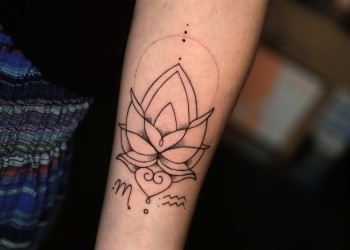 woman-fineline-mandala-tattoo-arm-black-dotwork
