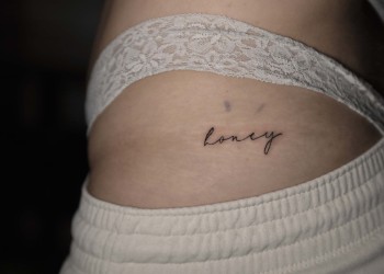 woman-honey-tattoo-hip-small-lettering